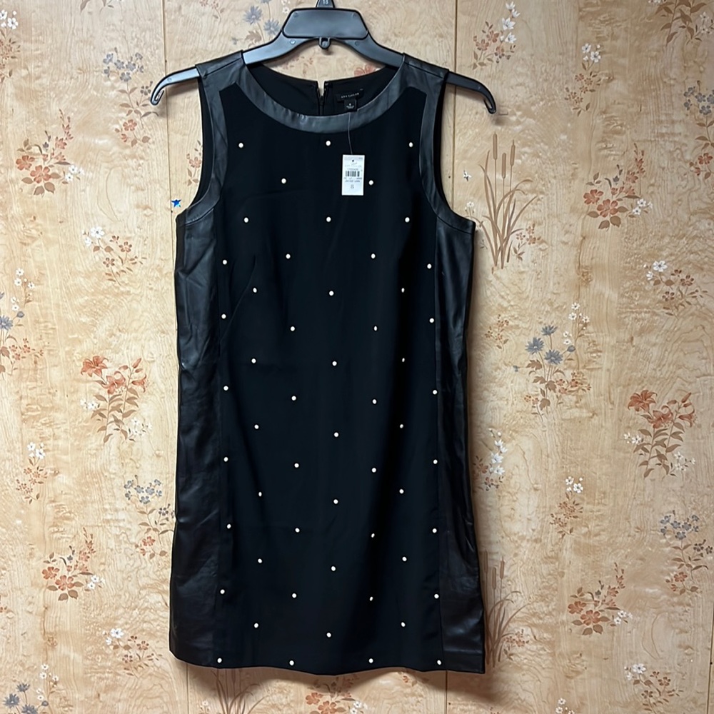 Black brand new dress with pearls and leather sides